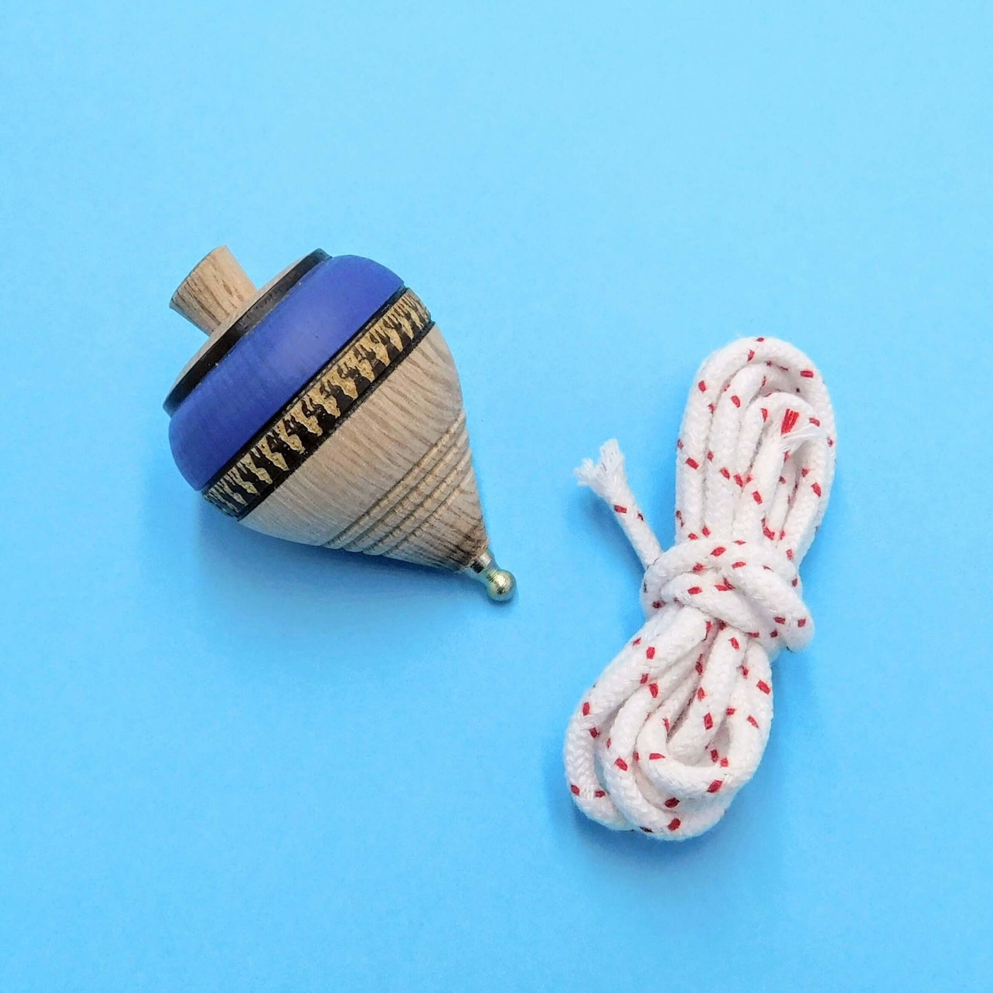 peonza de madera artesanal azul