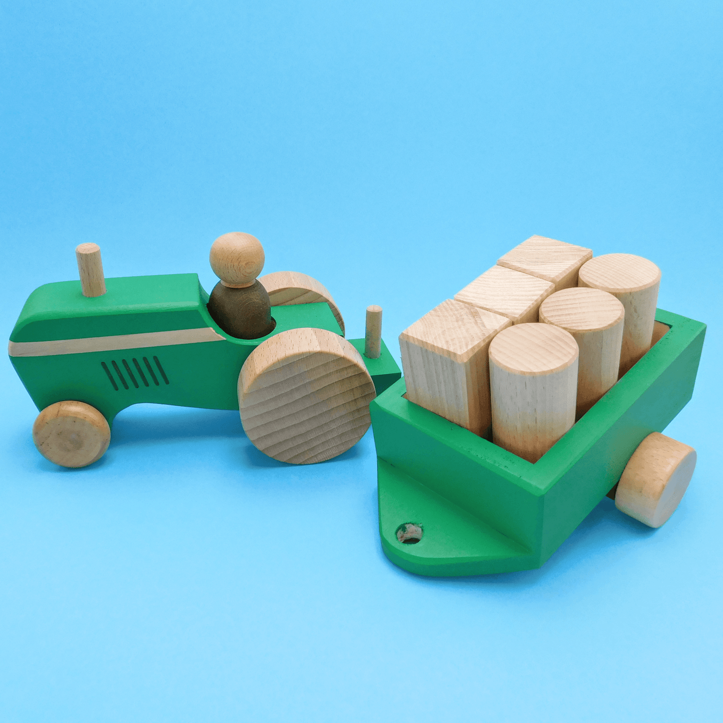 tractor de madera artesanal de juguete con muñeco