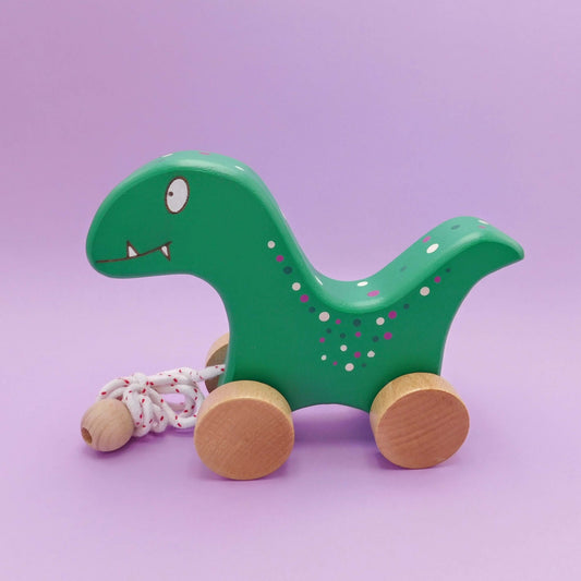 Dinosaurio de arrastre de madera artesanal