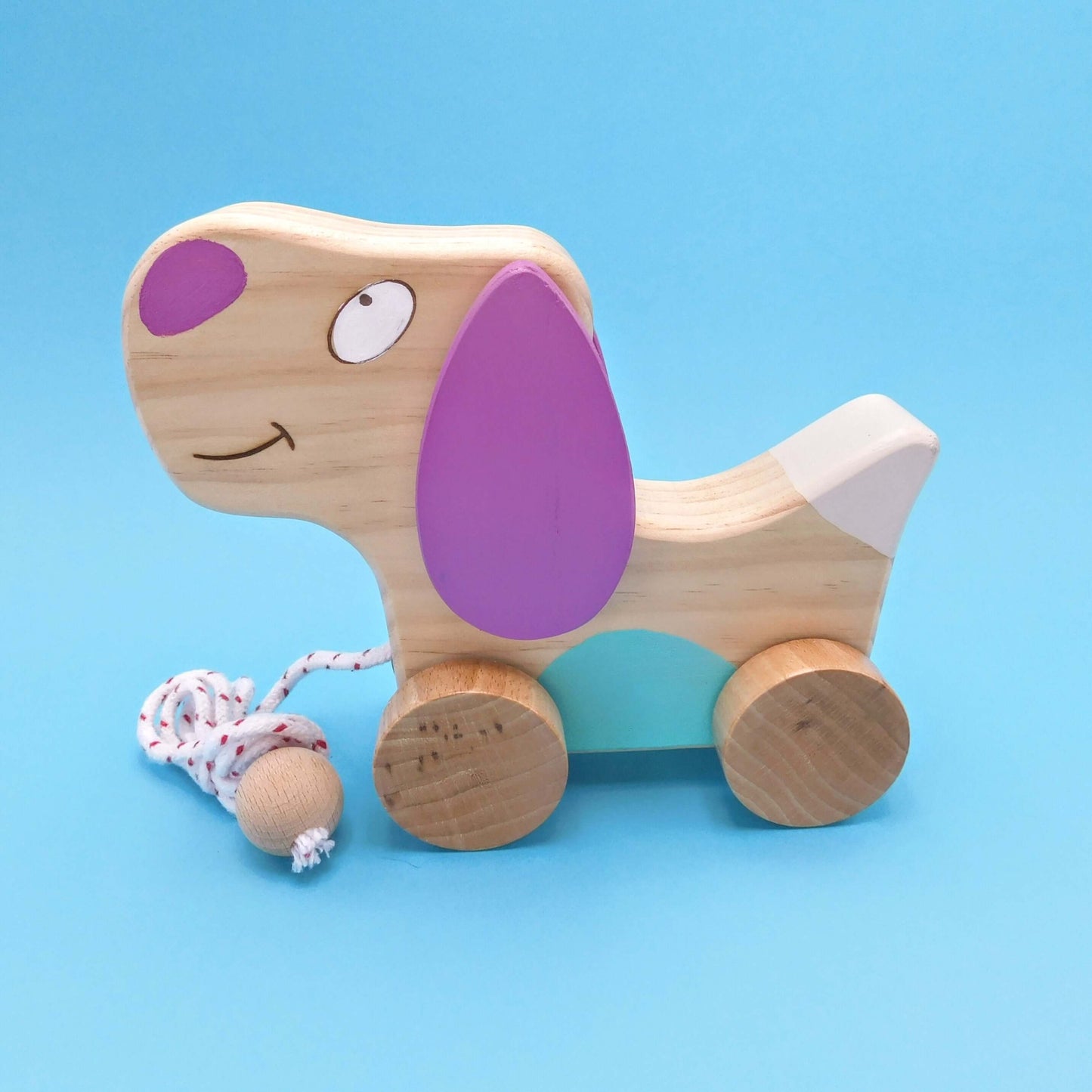 perro de madera de juguete artesanal violeta
