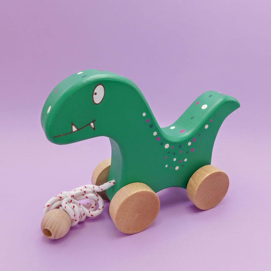 Dinosaurio de juguete de madera artesanal